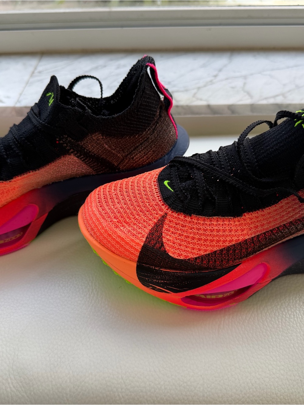 Nike Women's Neon Orange, Black & Pink Flyknit Sneakers